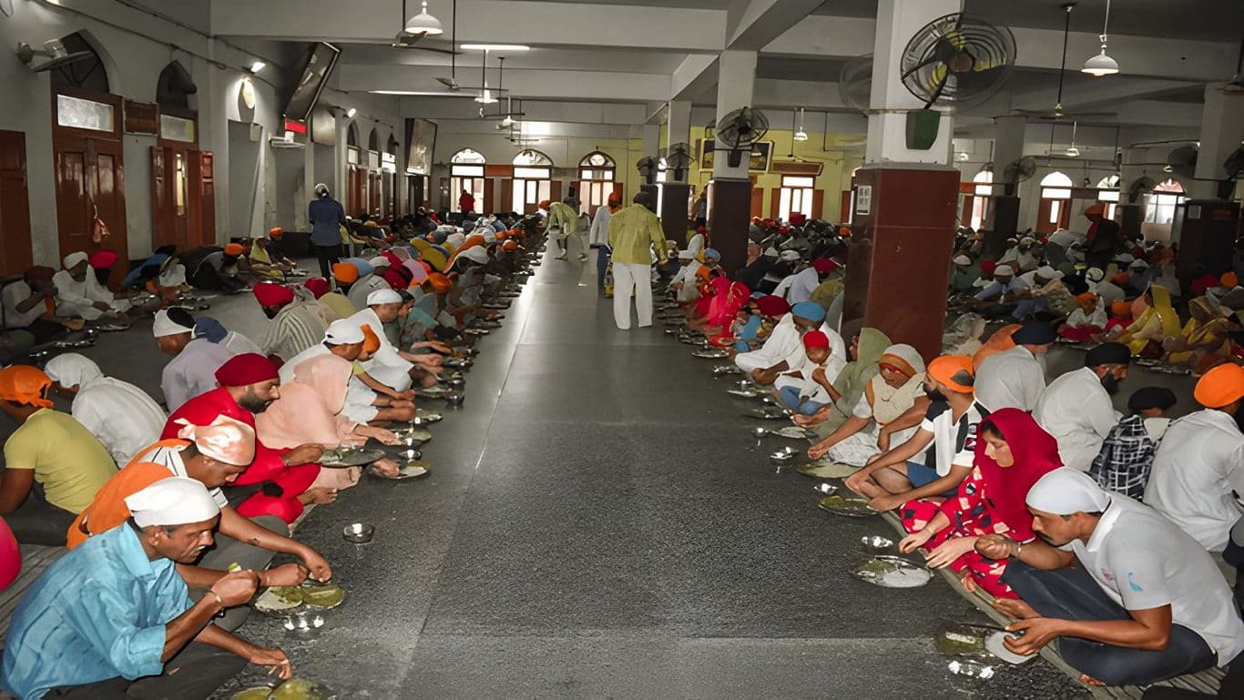 A Sewadaar serving food at Langar