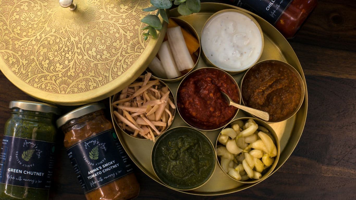 A bunch of chutney in bowls.