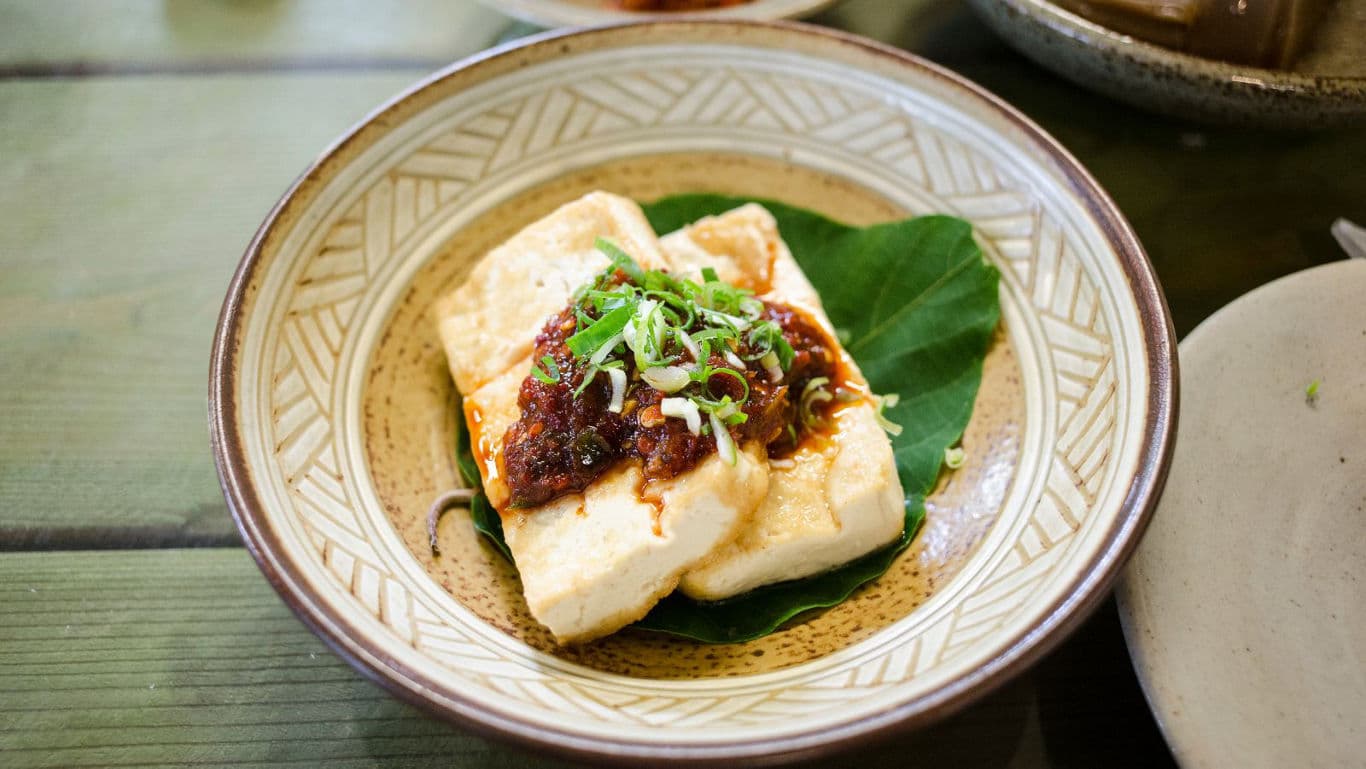 Tofu with Spicy Sauce and Green Onions in Bowl