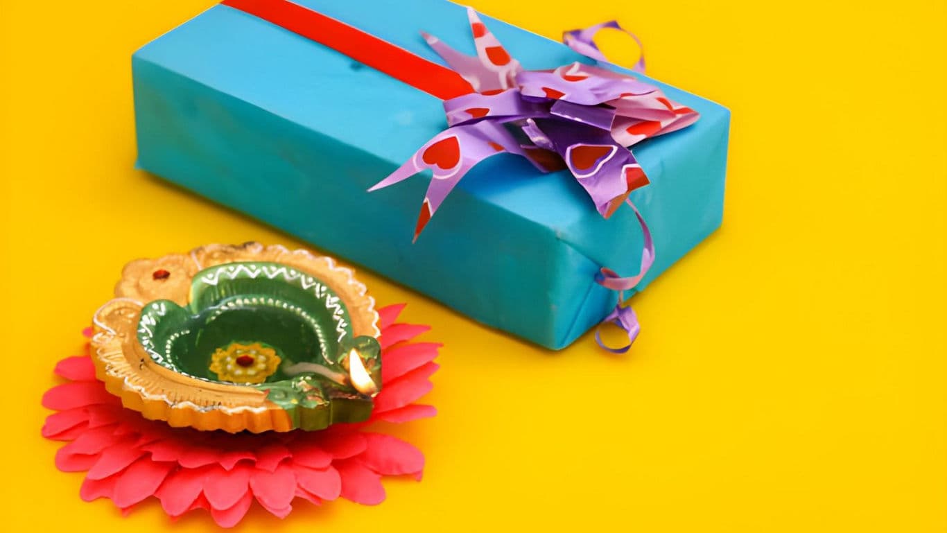 Colorful gift box with festive diya