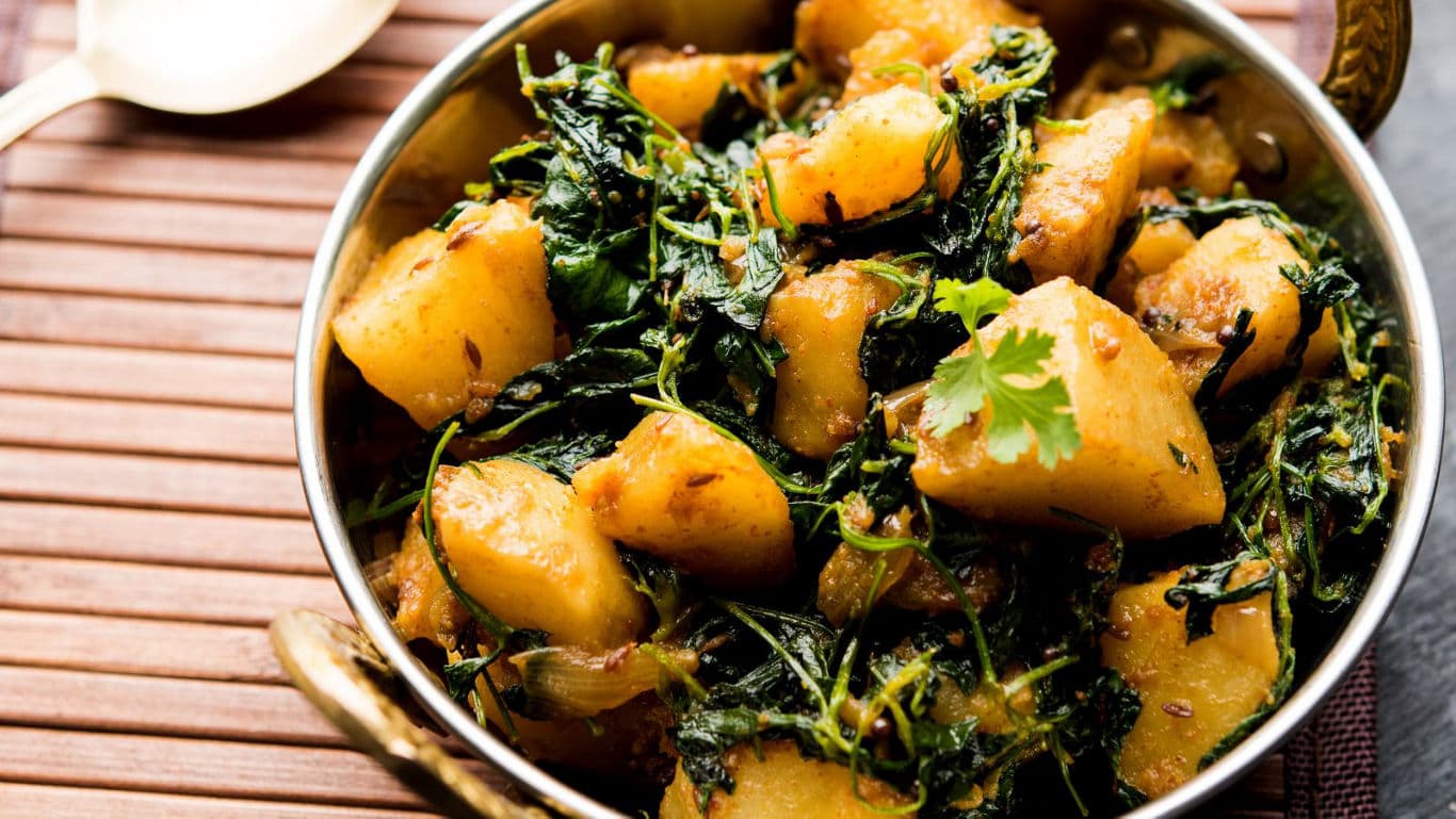 Traditional Indian Aloo Methi Curry in Brass Bowl