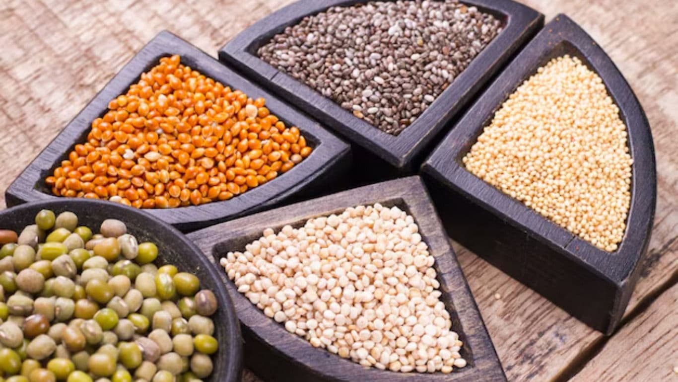 Assorted Superfood Seeds in Wooden Bowls on Table