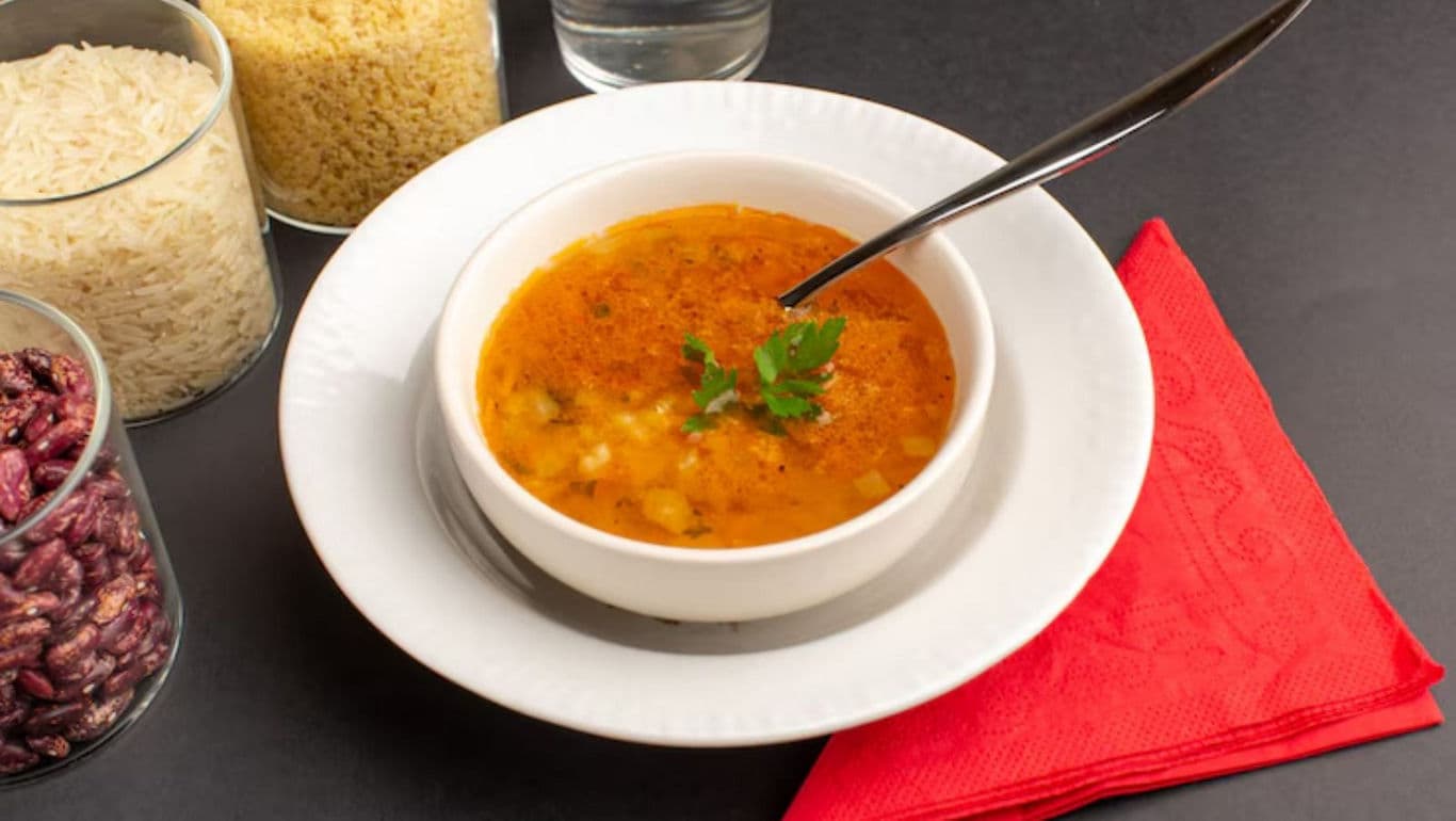 Bowl of soup with grains and beans