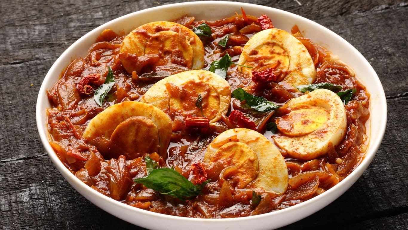 Spicy Egg Curry with Onions and Herbs