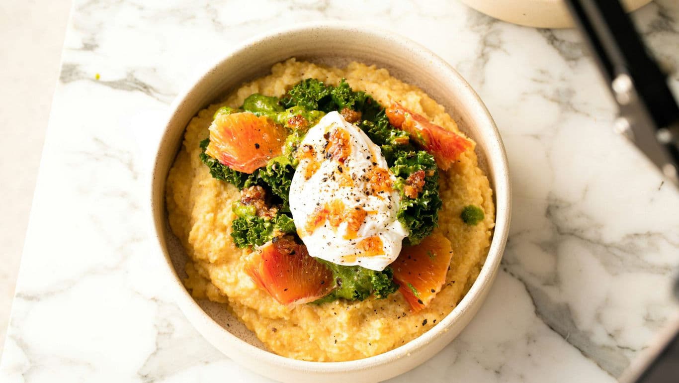 Creamy polenta with vegetables and poached egg
