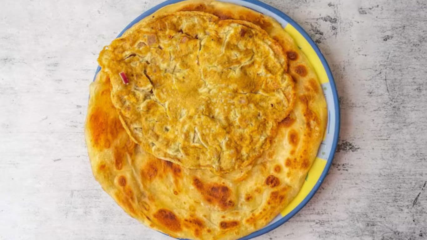 Golden flatbread with egg topping on plate