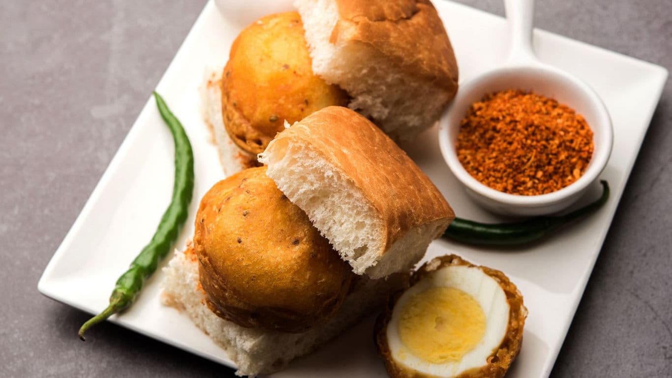 Egg-stuffed vada pav with chutney