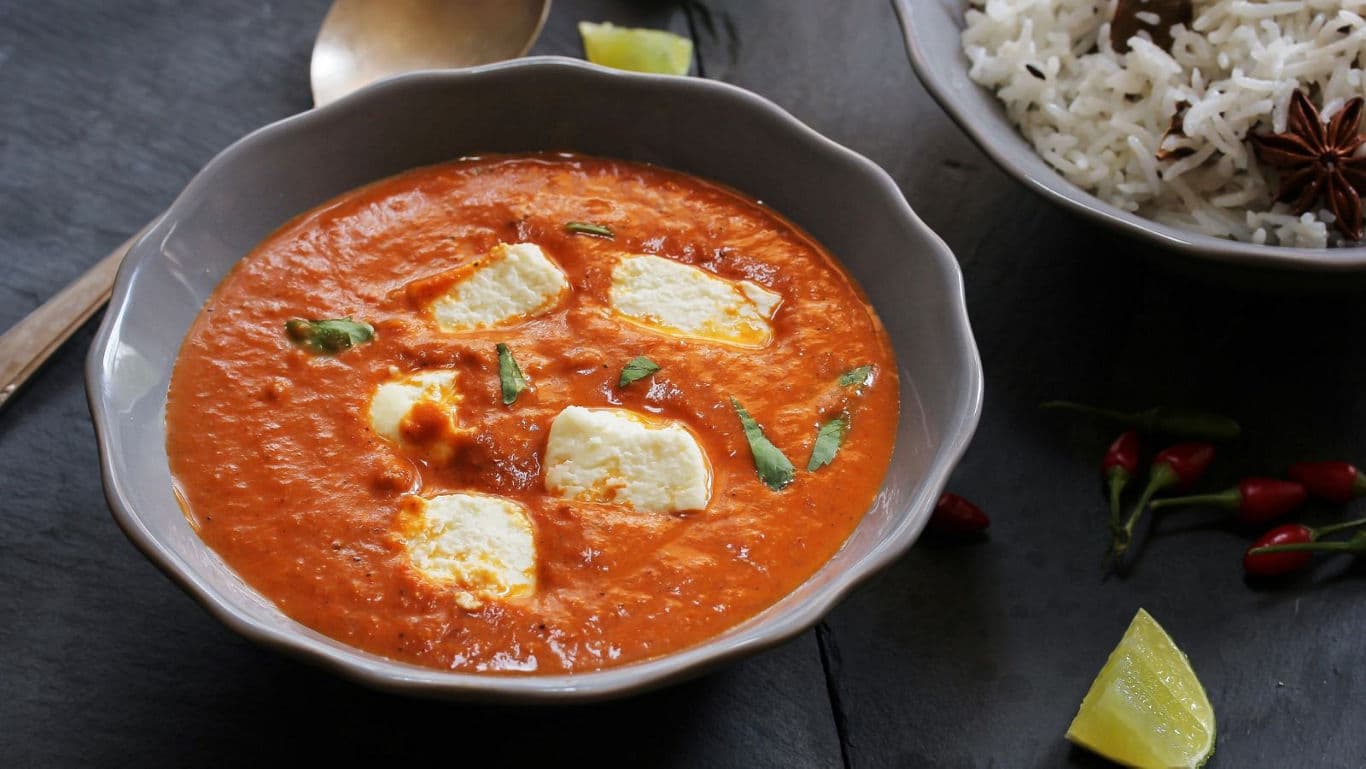 Creamy tomato curry with paneer and rice