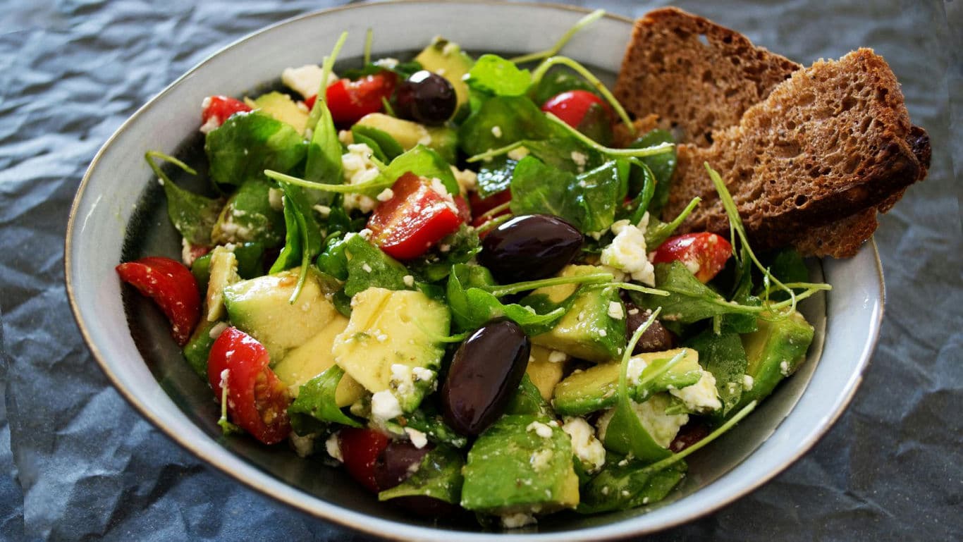 Fresh Mediterranean salad with bread slices