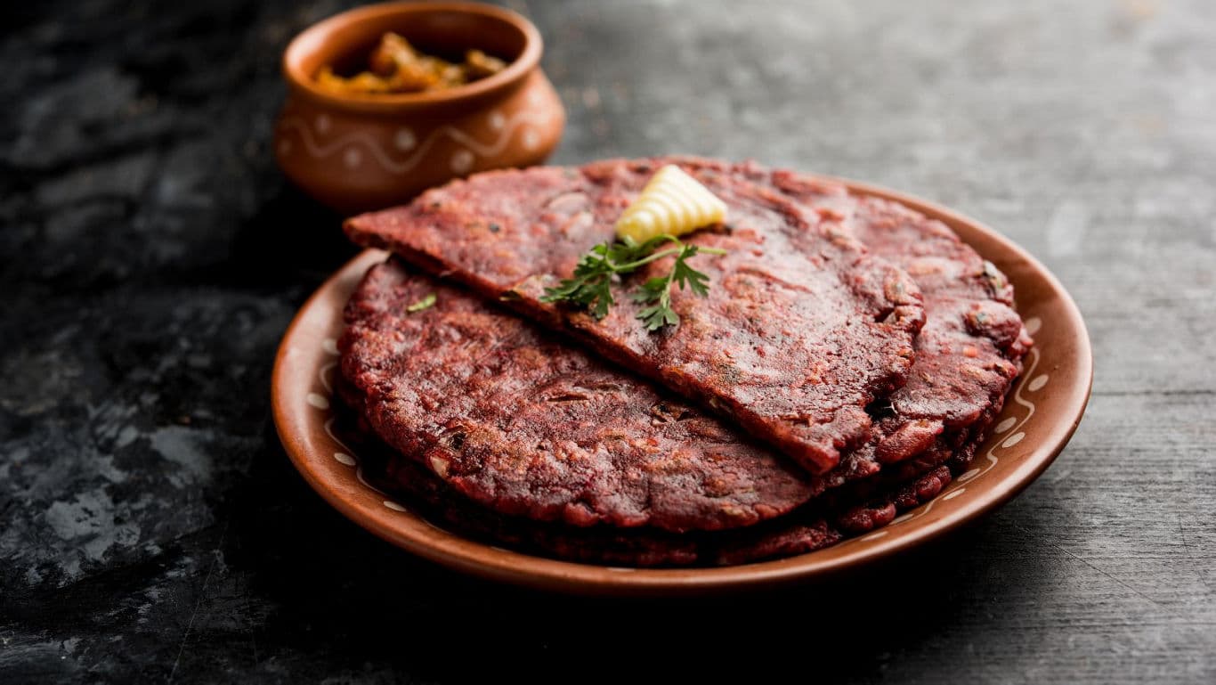 Top-down view of ragi chilla in a plate