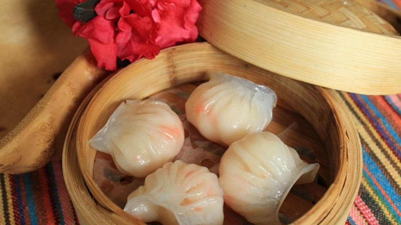 Steamed shrimp dumplings in bamboo basket