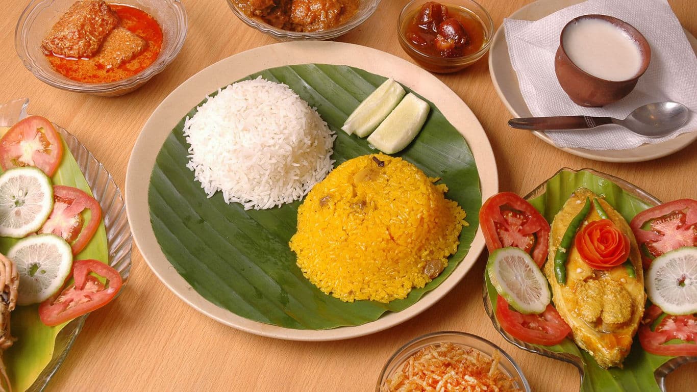 Traditional Bengali meal with rice and curry