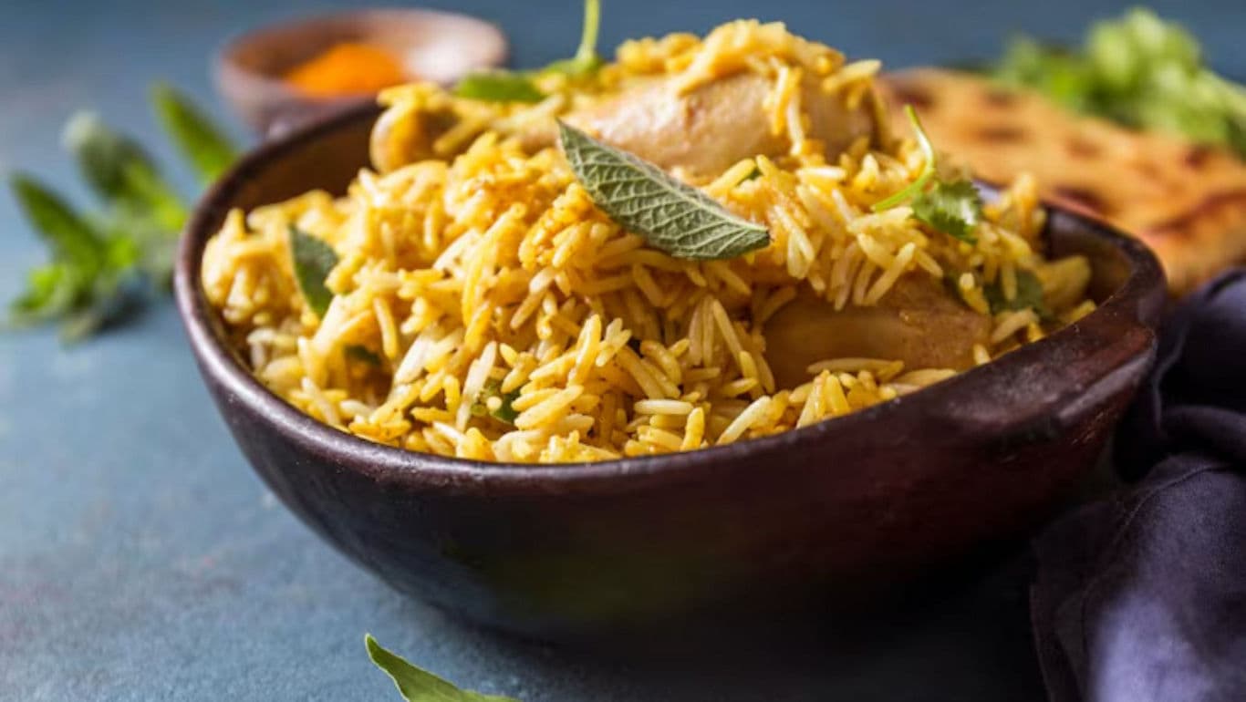 Delicious chicken biryani in rustic bowl