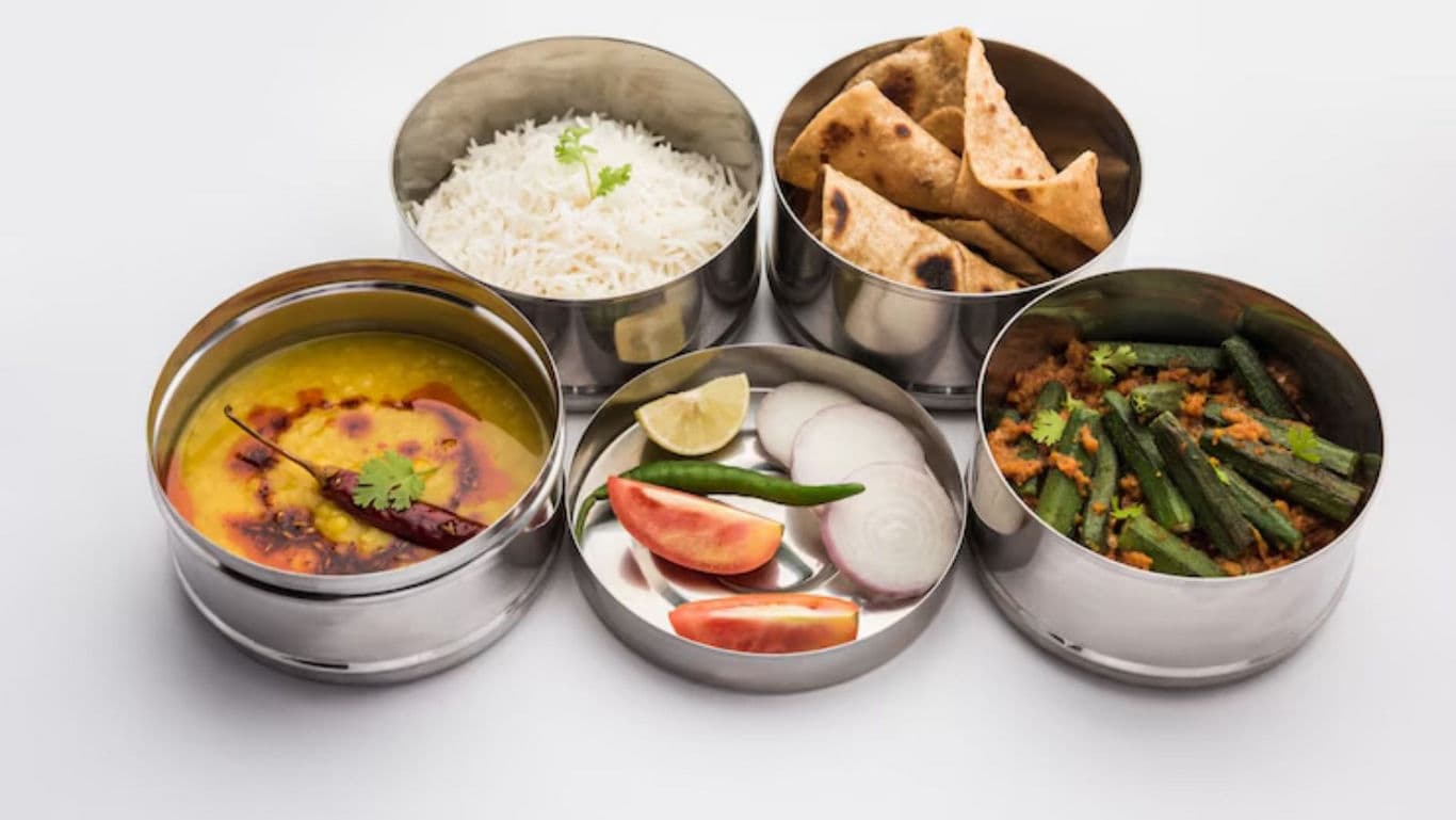 Indian meal in stainless steel containers
