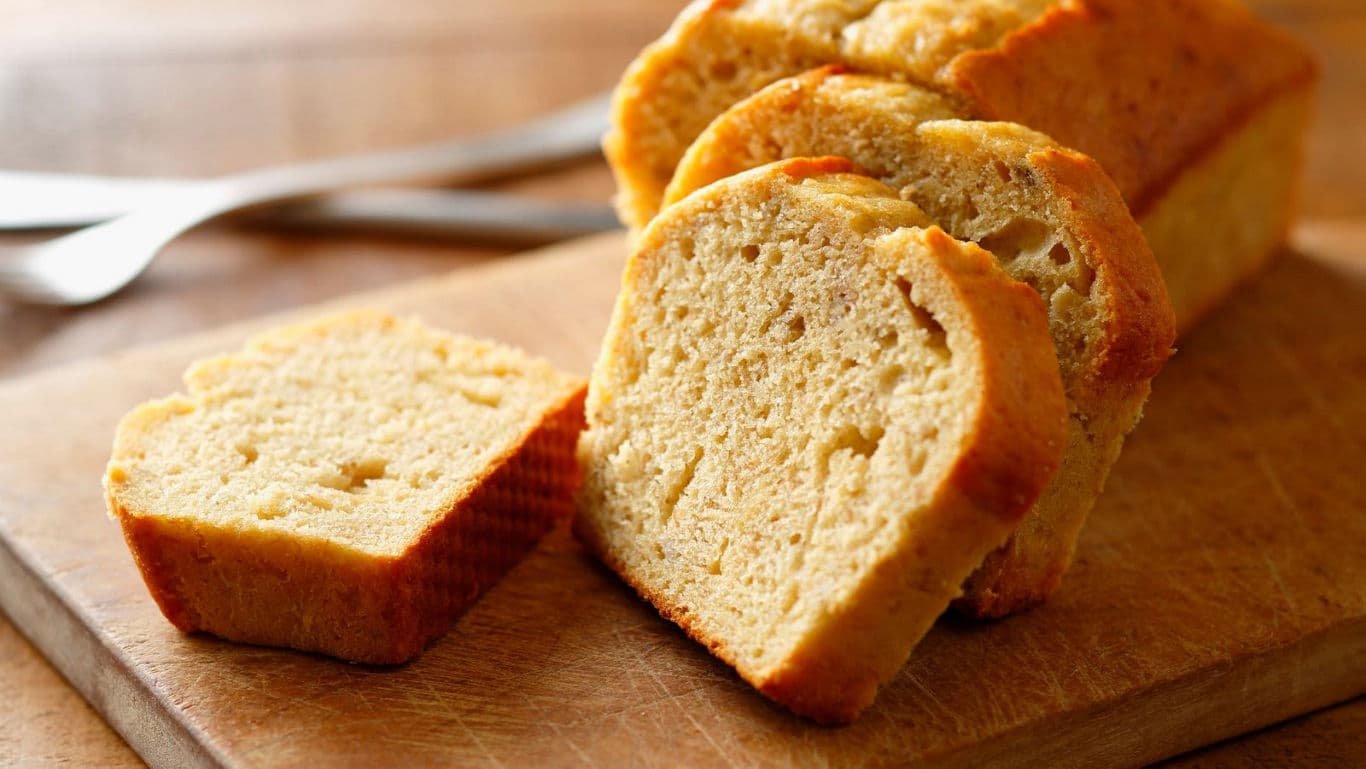 Freshly sliced loaf of bread on board
