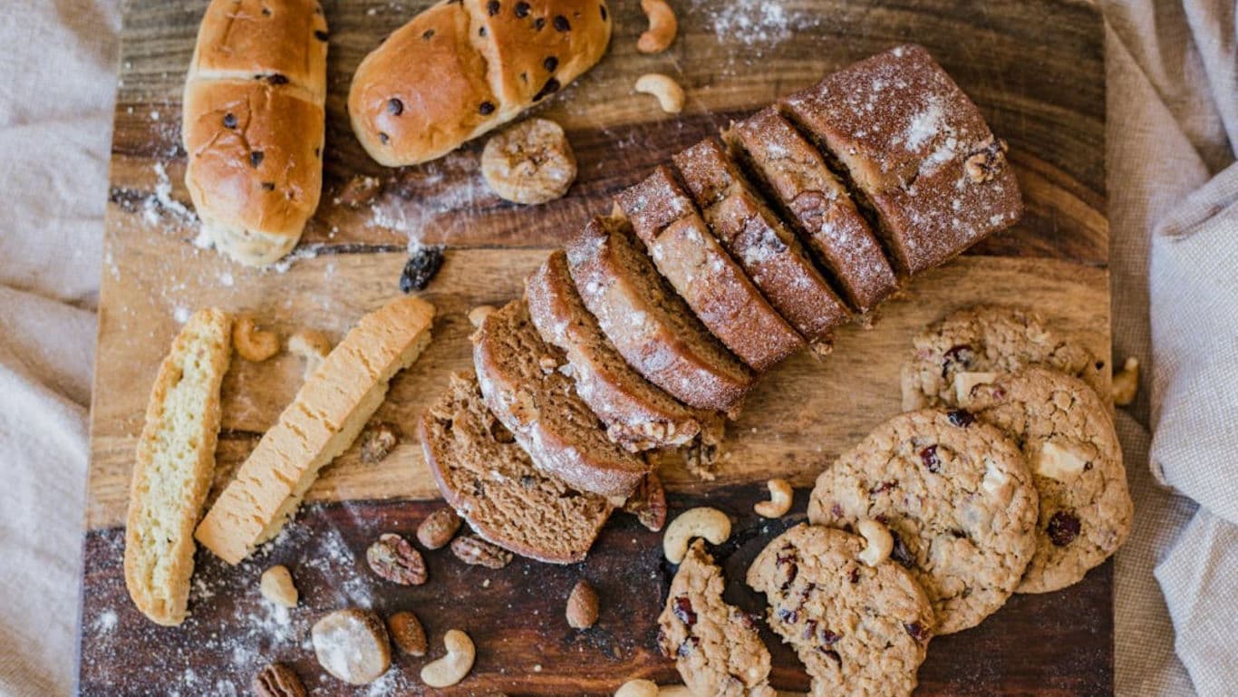 Assorted Breads and Cookies on Wooden Board