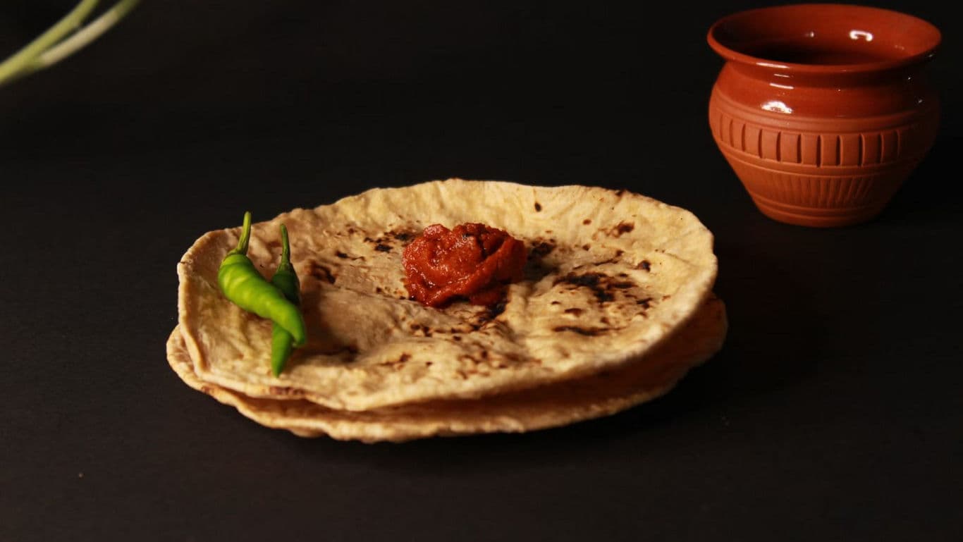 Traditional flatbread with chili and pickle