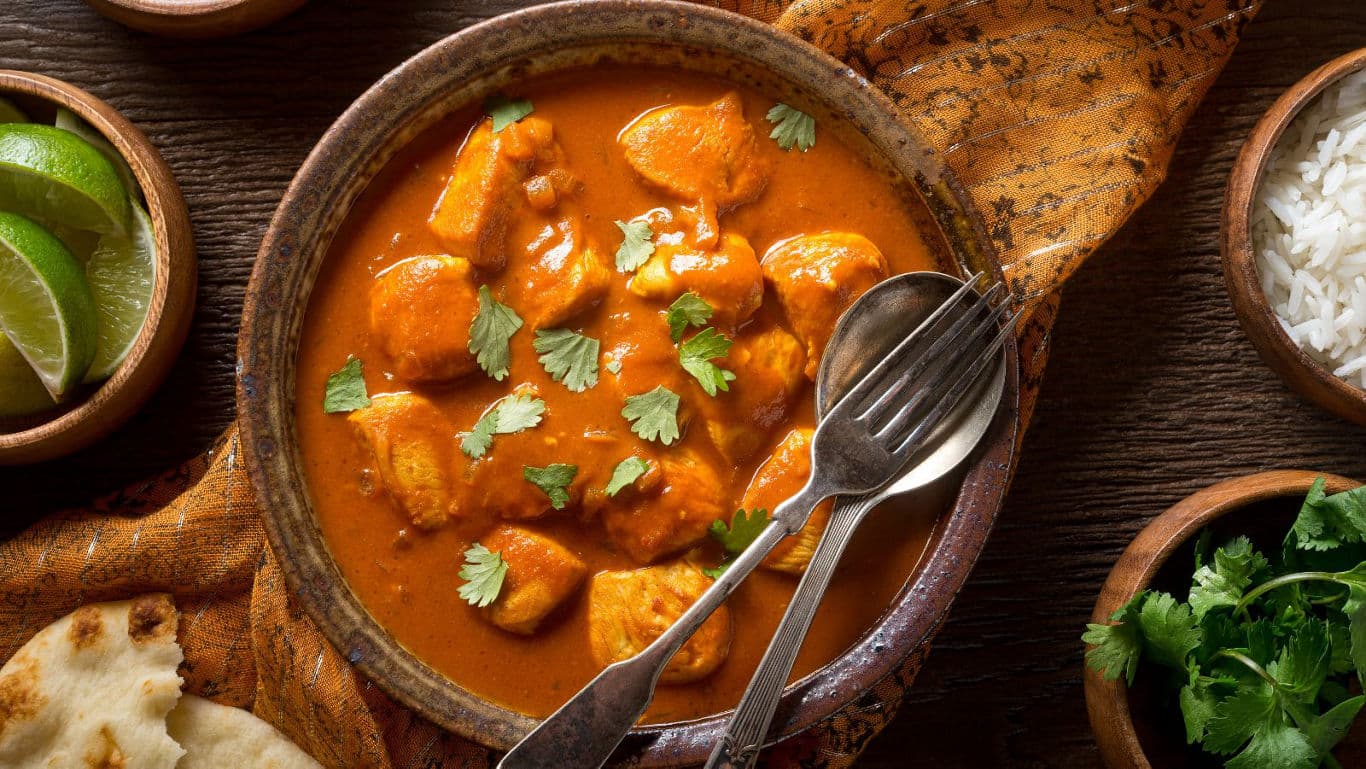 Traditional Indian Chicken Curry with Rice and Naan