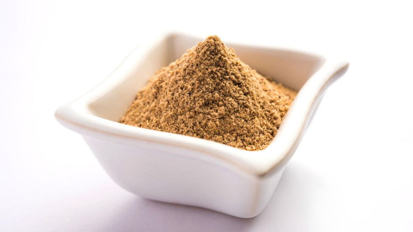 Bowl of ground spice in white dish