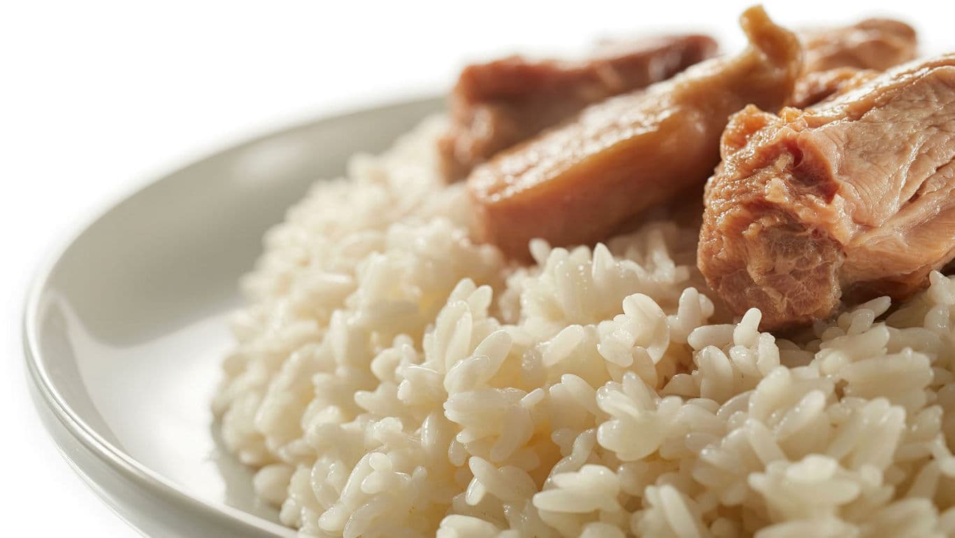 Closeup of cooked rice with meat pieces