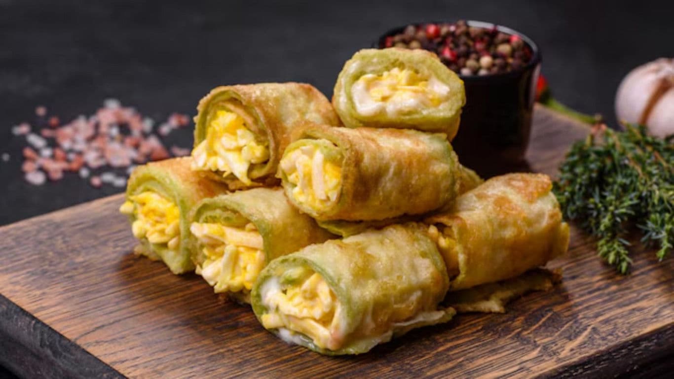 Crispy Egg-Stuffed Rolls on Wooden Board