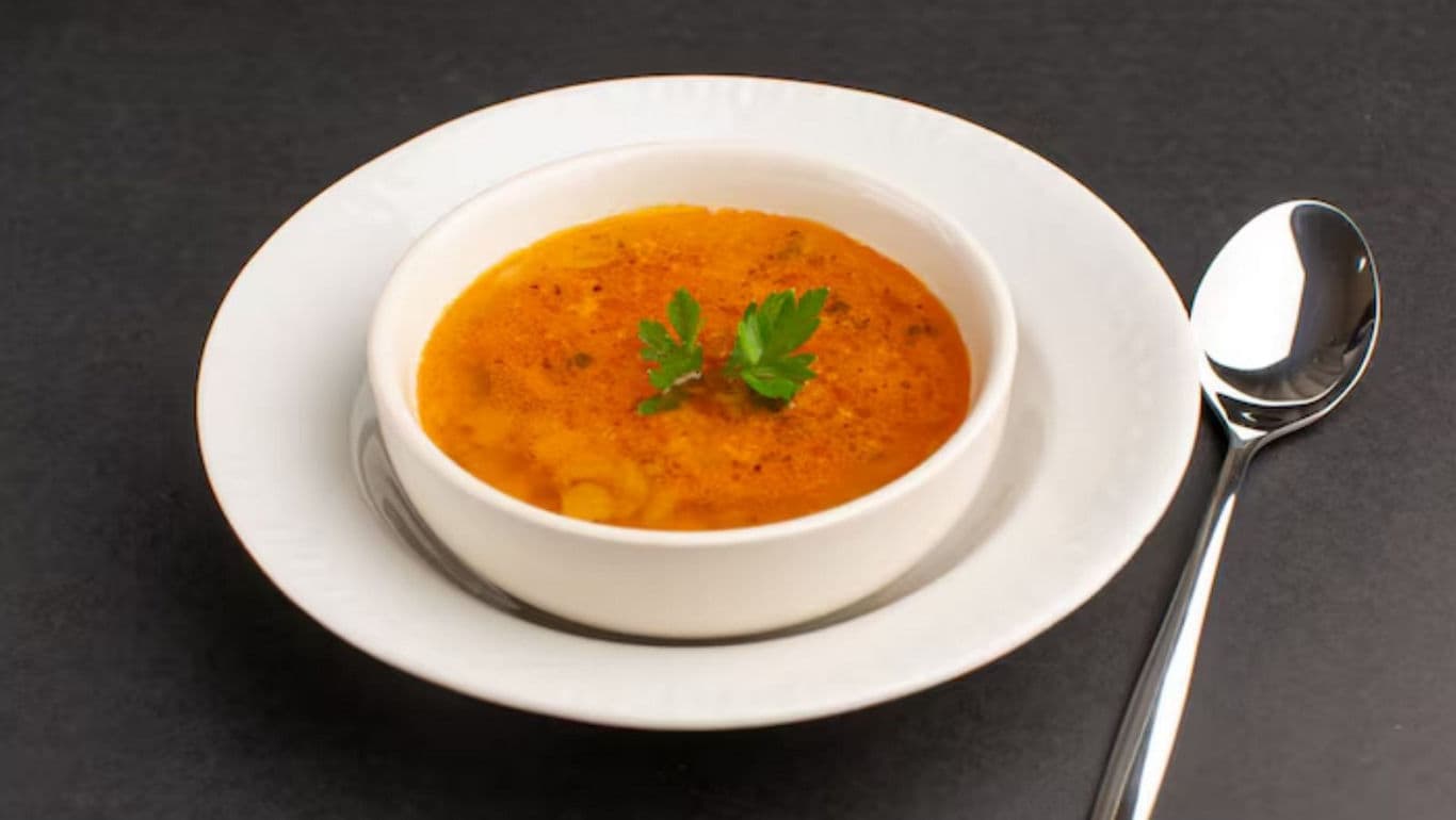Bowl of Tomato Soup with Parsley Garnish