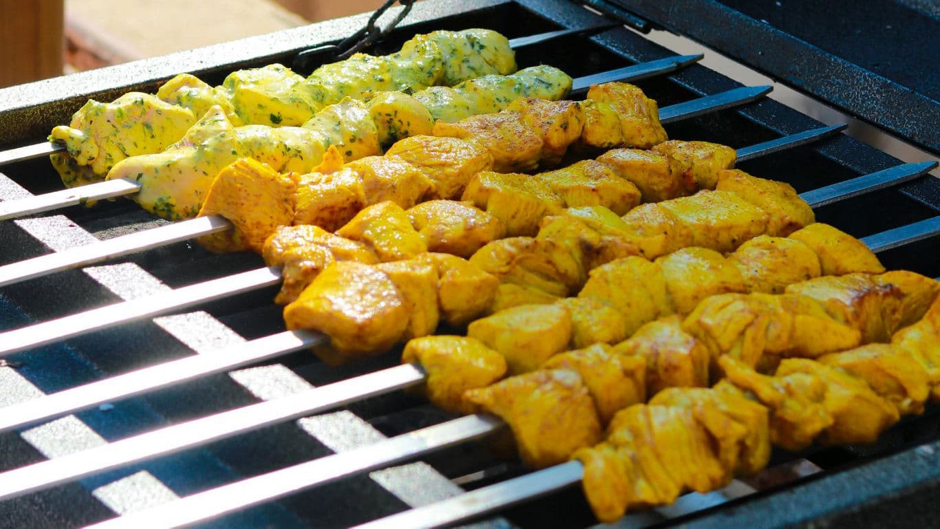 Grilled chicken skewers with vibrant spices