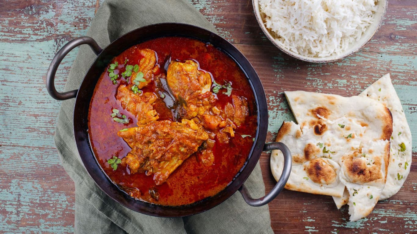 Spicy curry with naan and rice