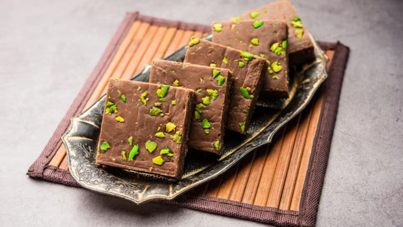 Chocolate fudge squares with pistachio garnish