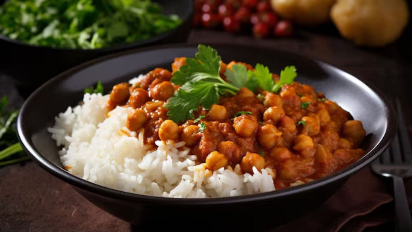 Chickpea Curry with Rice in Black Bowl