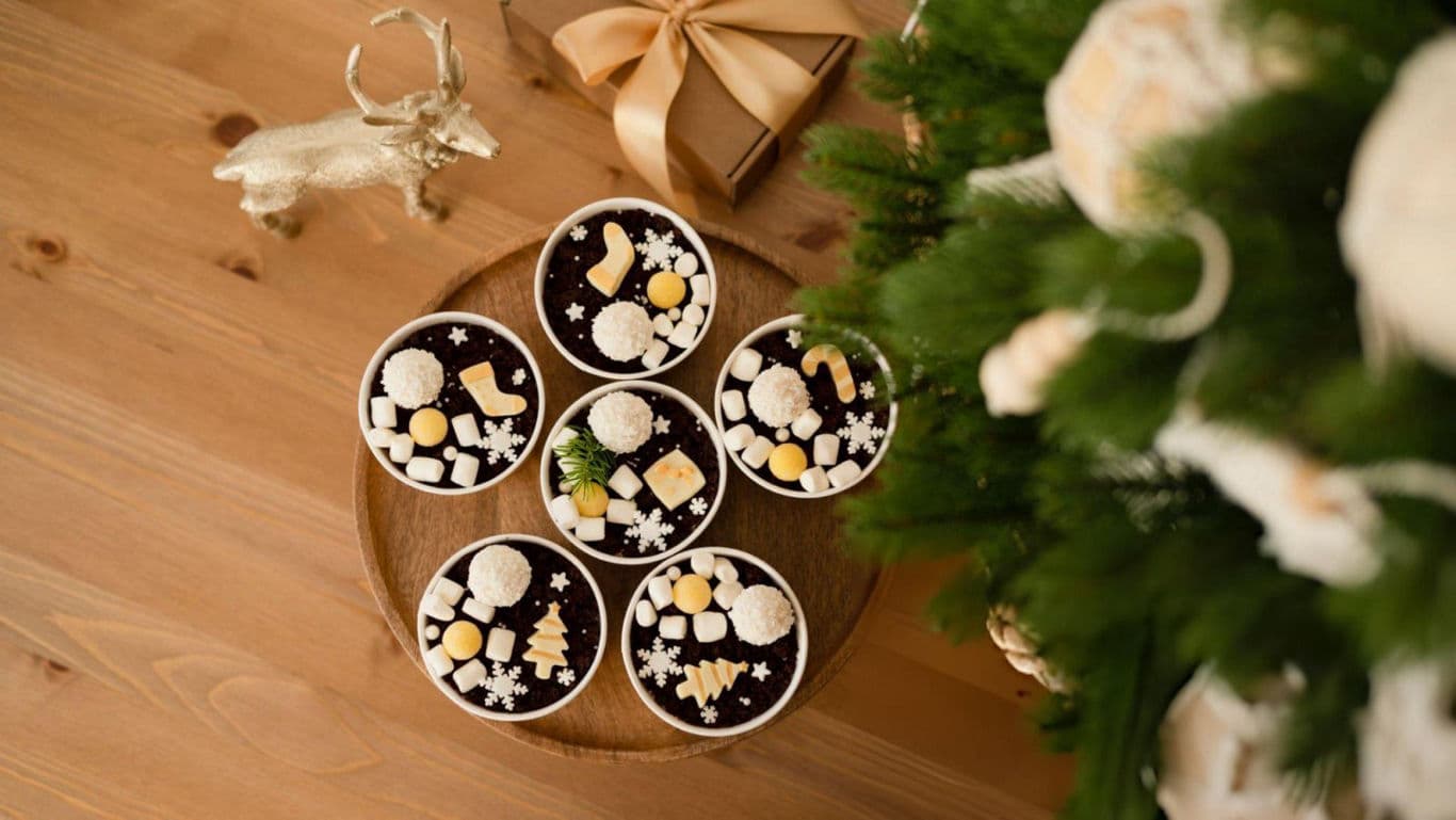 Chocolate pudding topped with marshmallows and candies