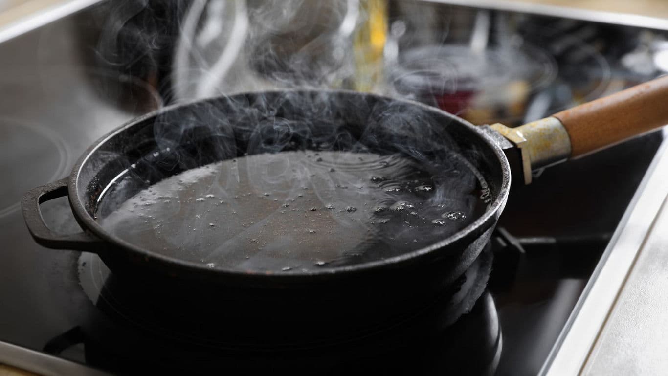Hot cast iron skillet on stovetop