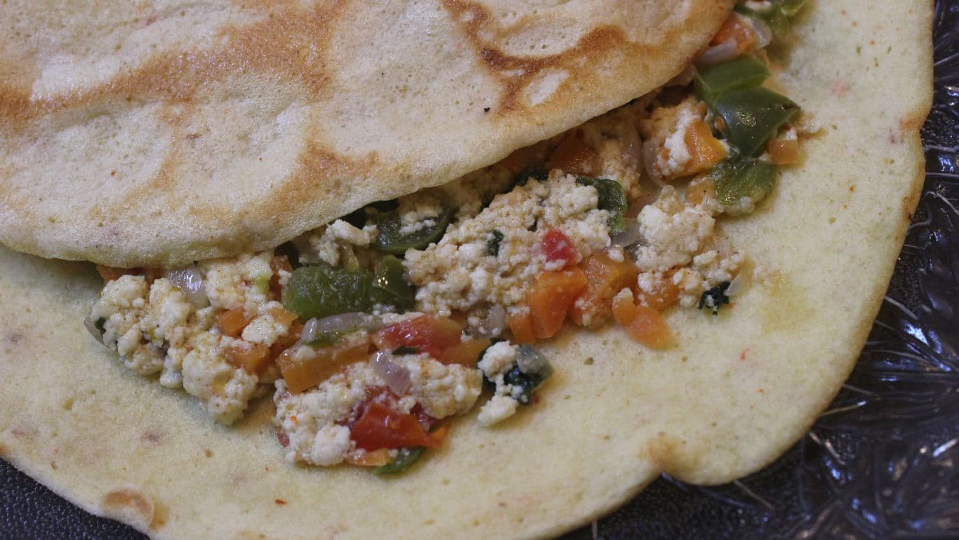Close-up of stuffed flatbread with vegetables