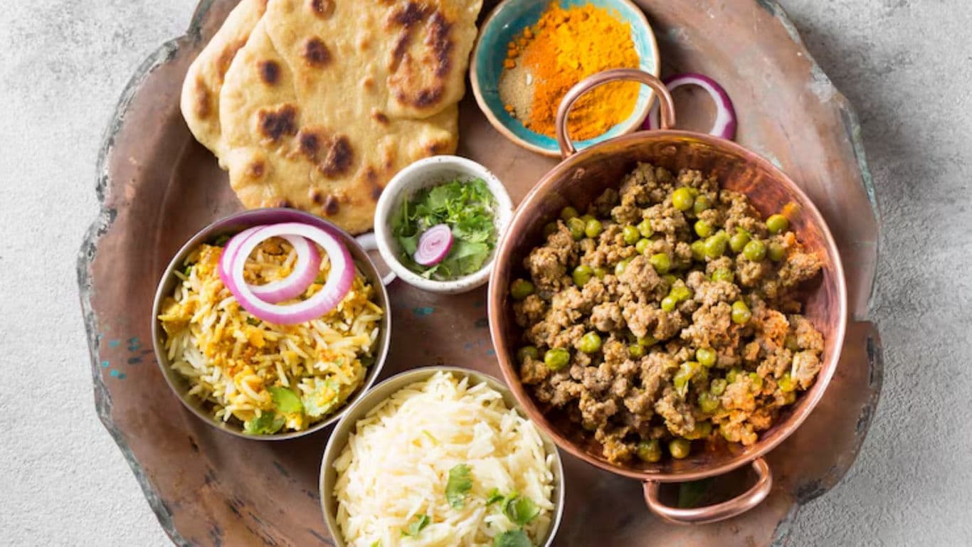 Traditional Indian meal with naan, rice, and curry