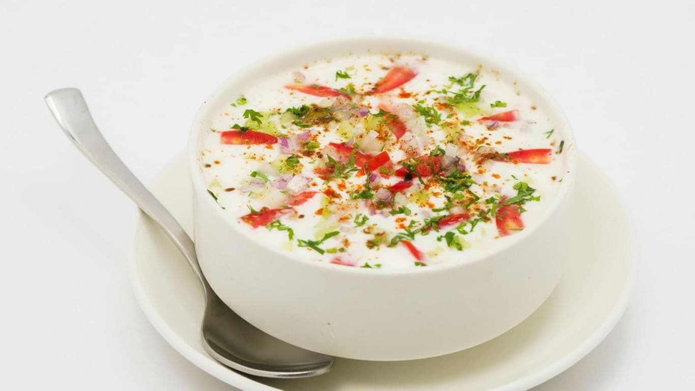 Bowl of yogurt salad with fresh toppings