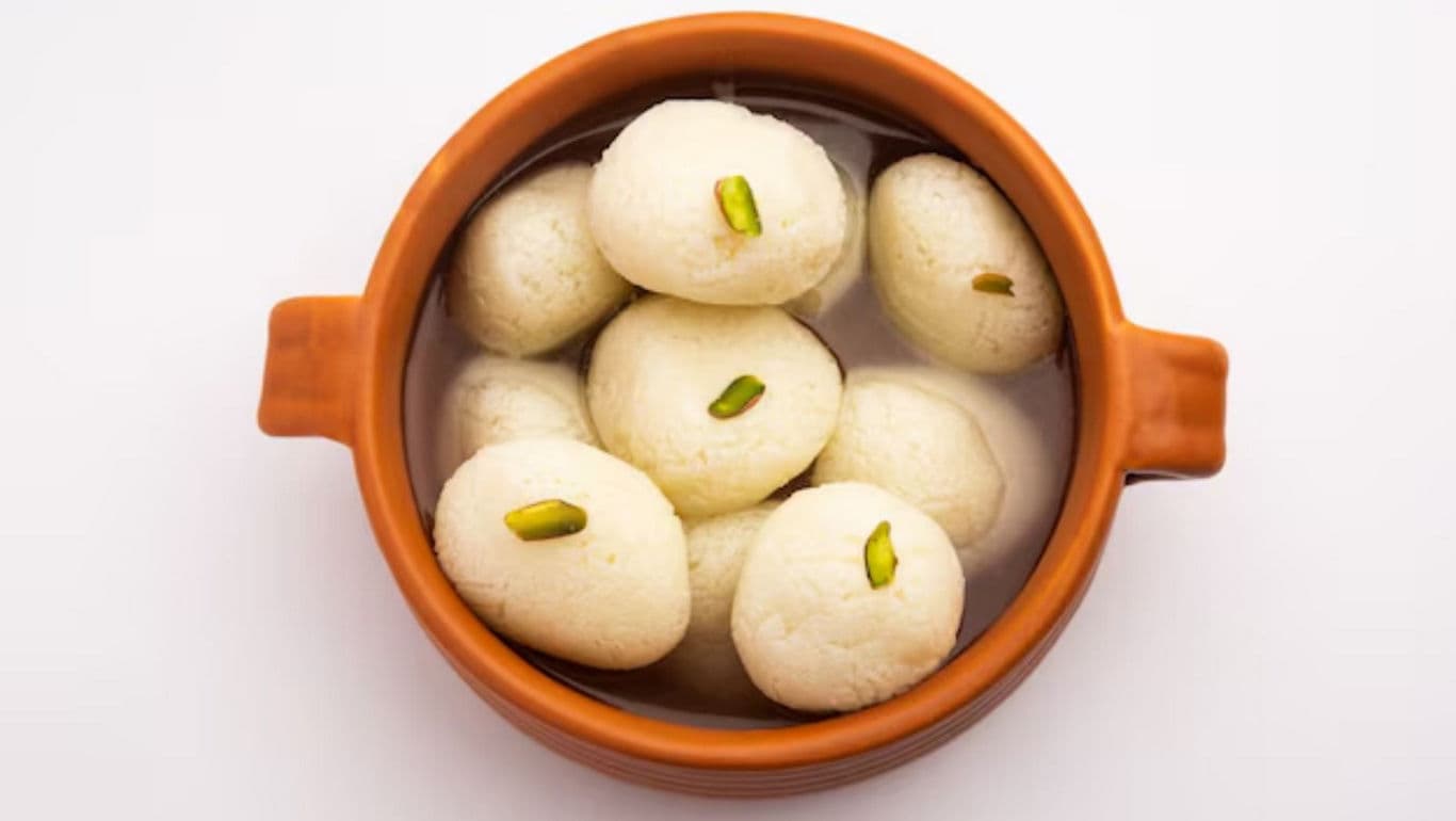 Traditional Rasgulla Sweets in Brown Clay Bowl