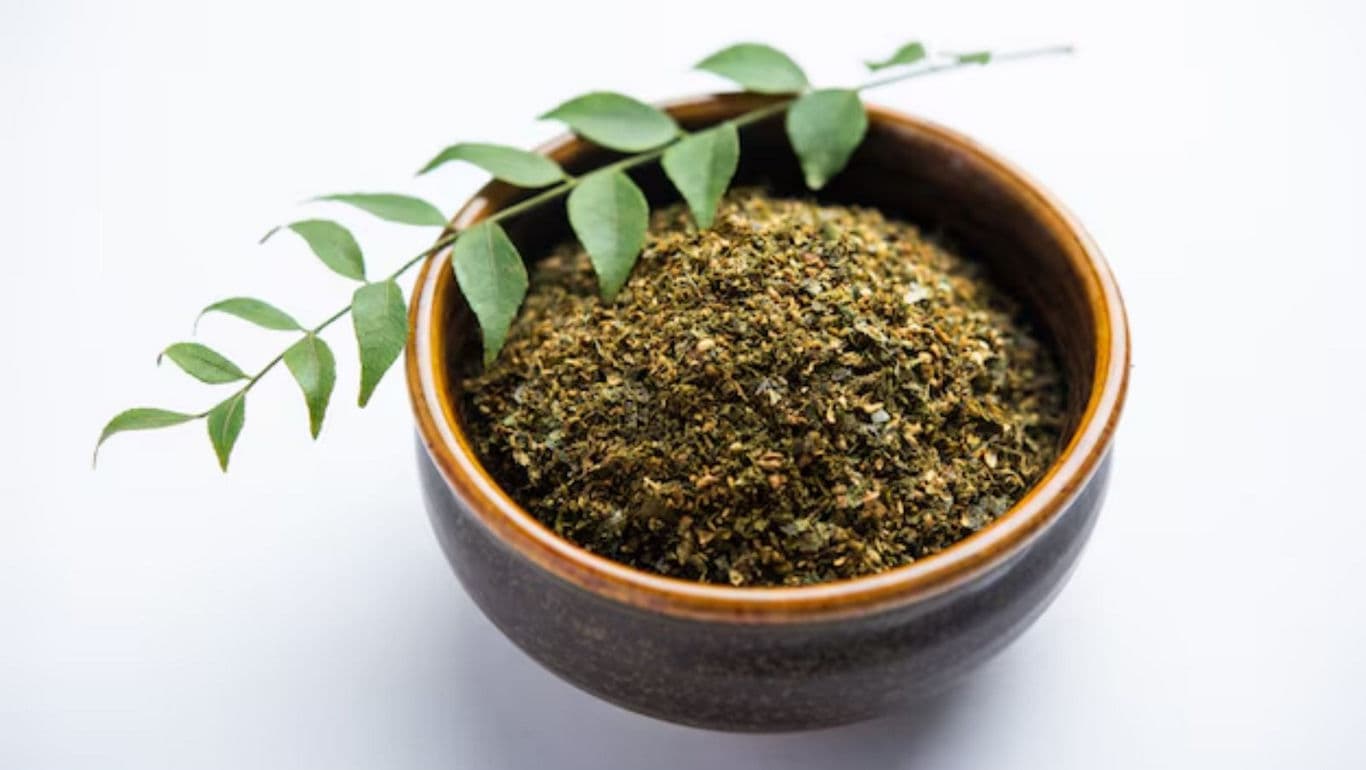Bowl of dried spice with curry leaves