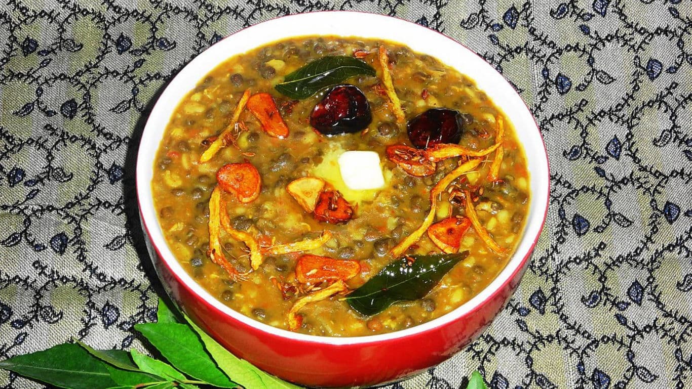 Spiced lentil curry in red bowl