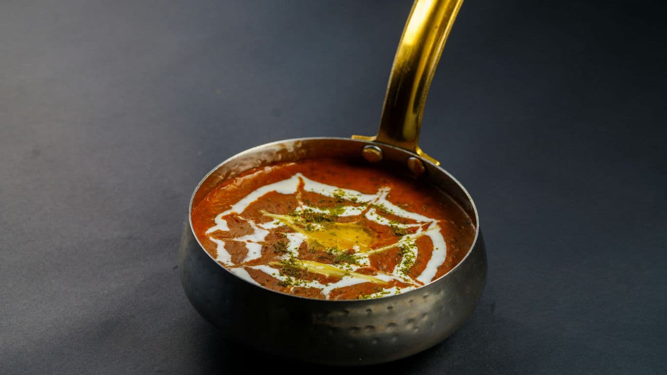 Traditional Indian Dal Makhani in Brass Handi