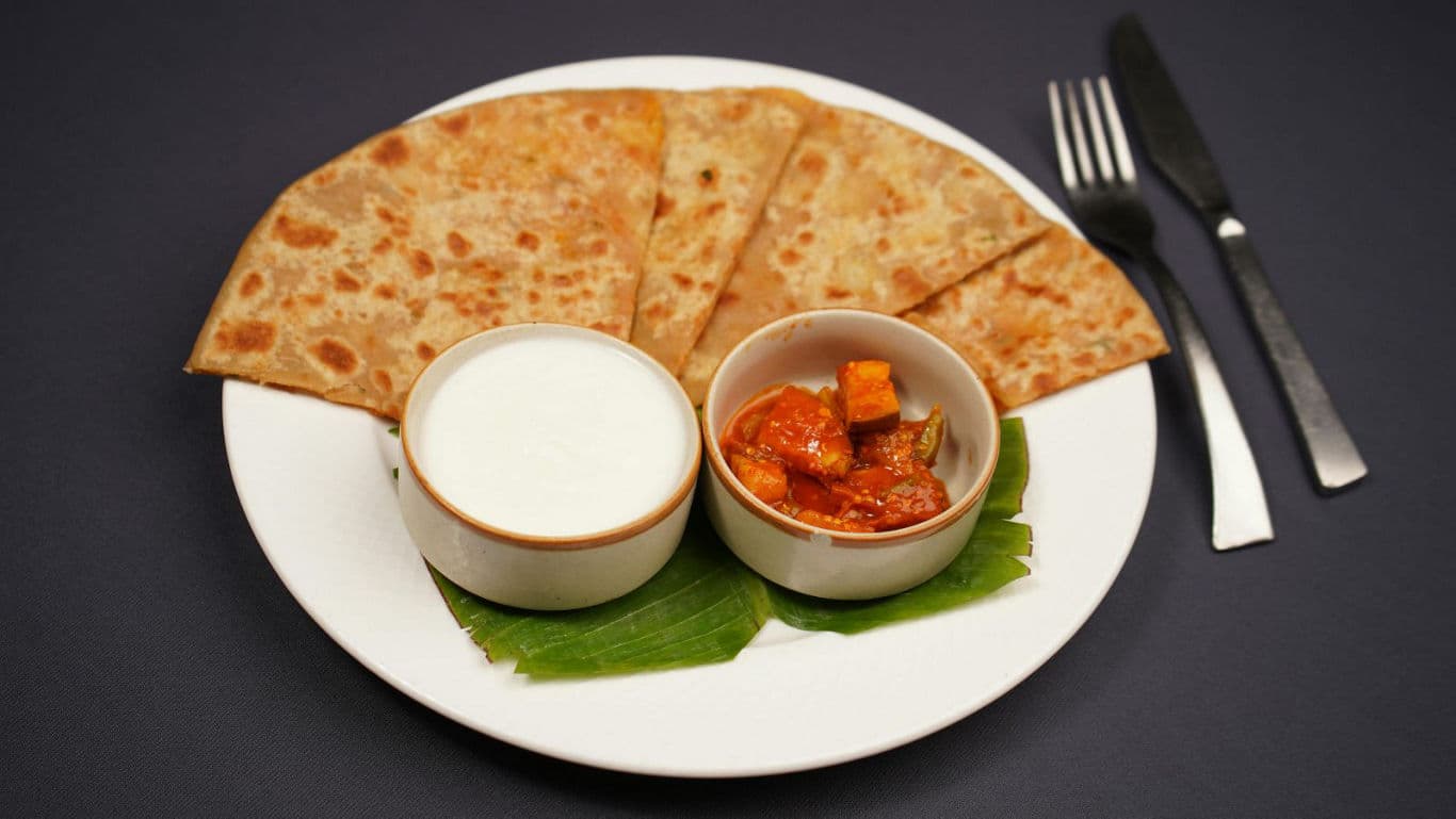 Indian flatbread with yogurt and curry