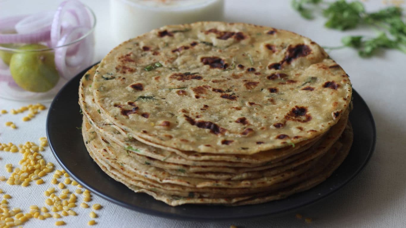 Stack of Indian flatbreads with sides