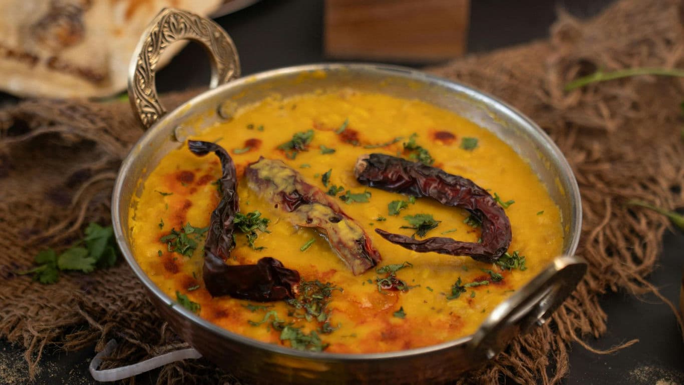Traditional Indian dal tadka with dried red chilies