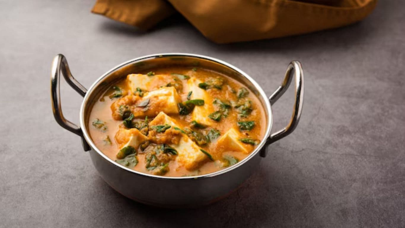 Paneer curry in stainless steel bowl