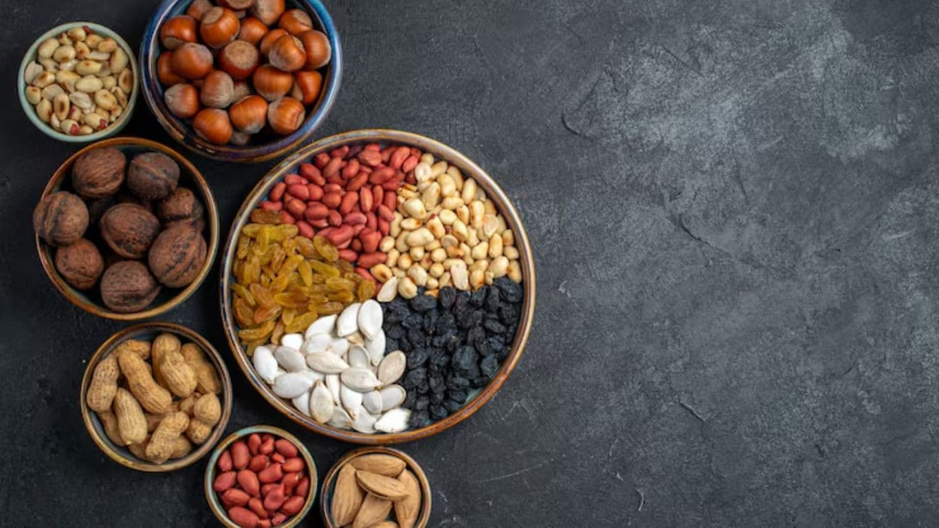 Assorted nuts and dried fruits in bowls