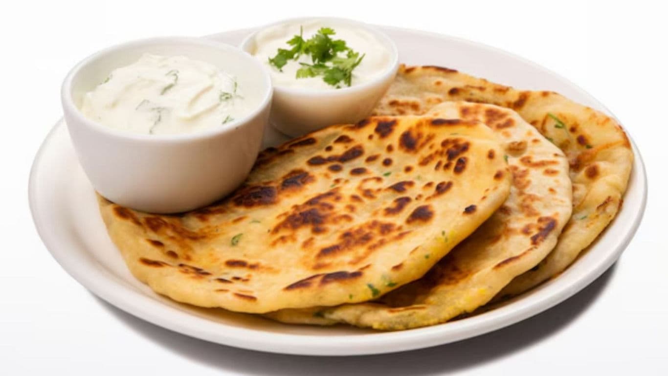 Stuffed flatbread with yogurt garnish