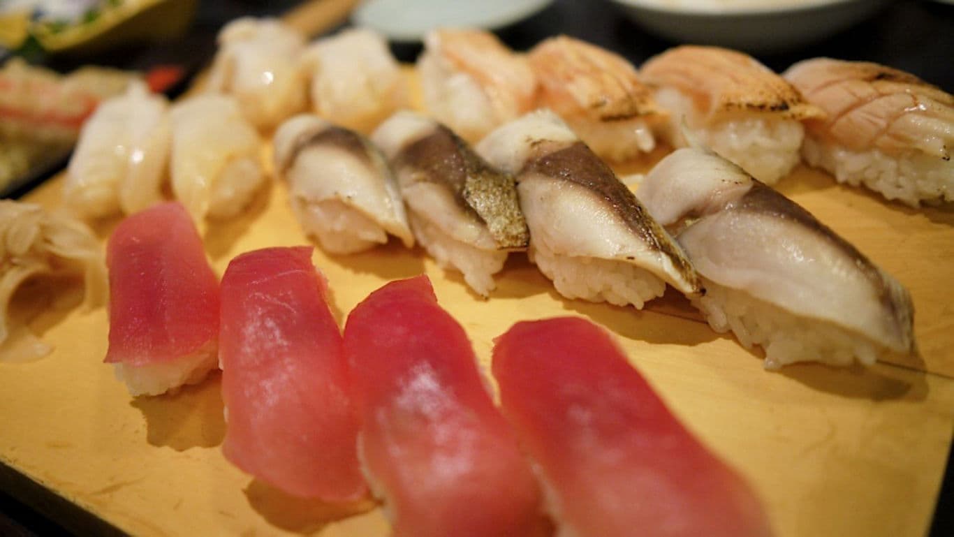 Assorted sushi platter on wooden tray