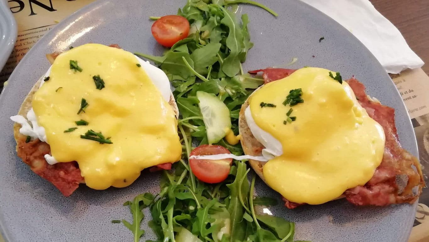 Eggs Benedict with Hollandaise Sauce and Salad Greens