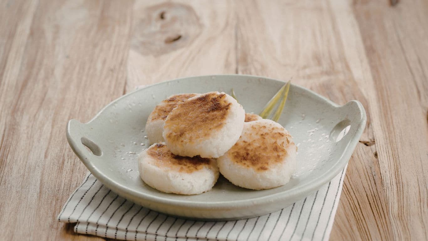 Grilled rice cakes on rustic ceramic plate