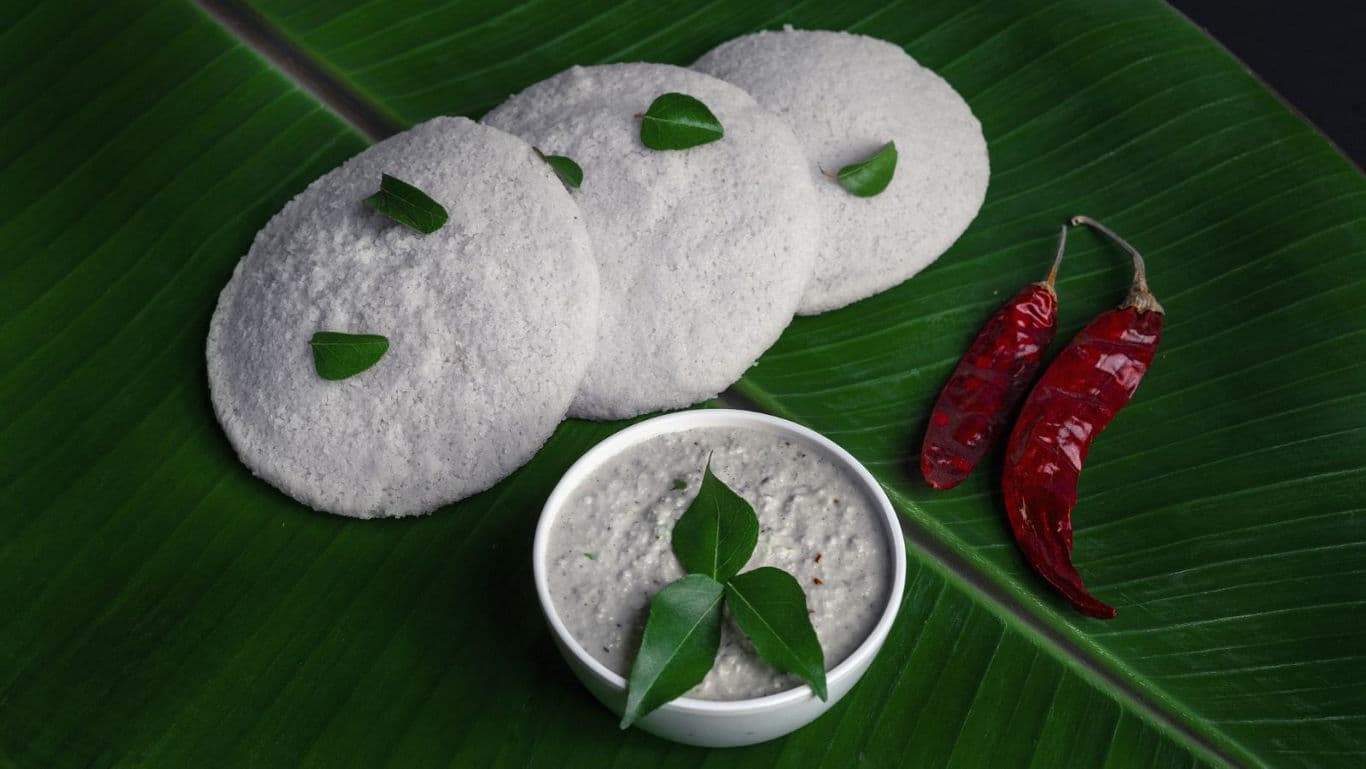 South Indian idli with coconut chutney on banana leaf