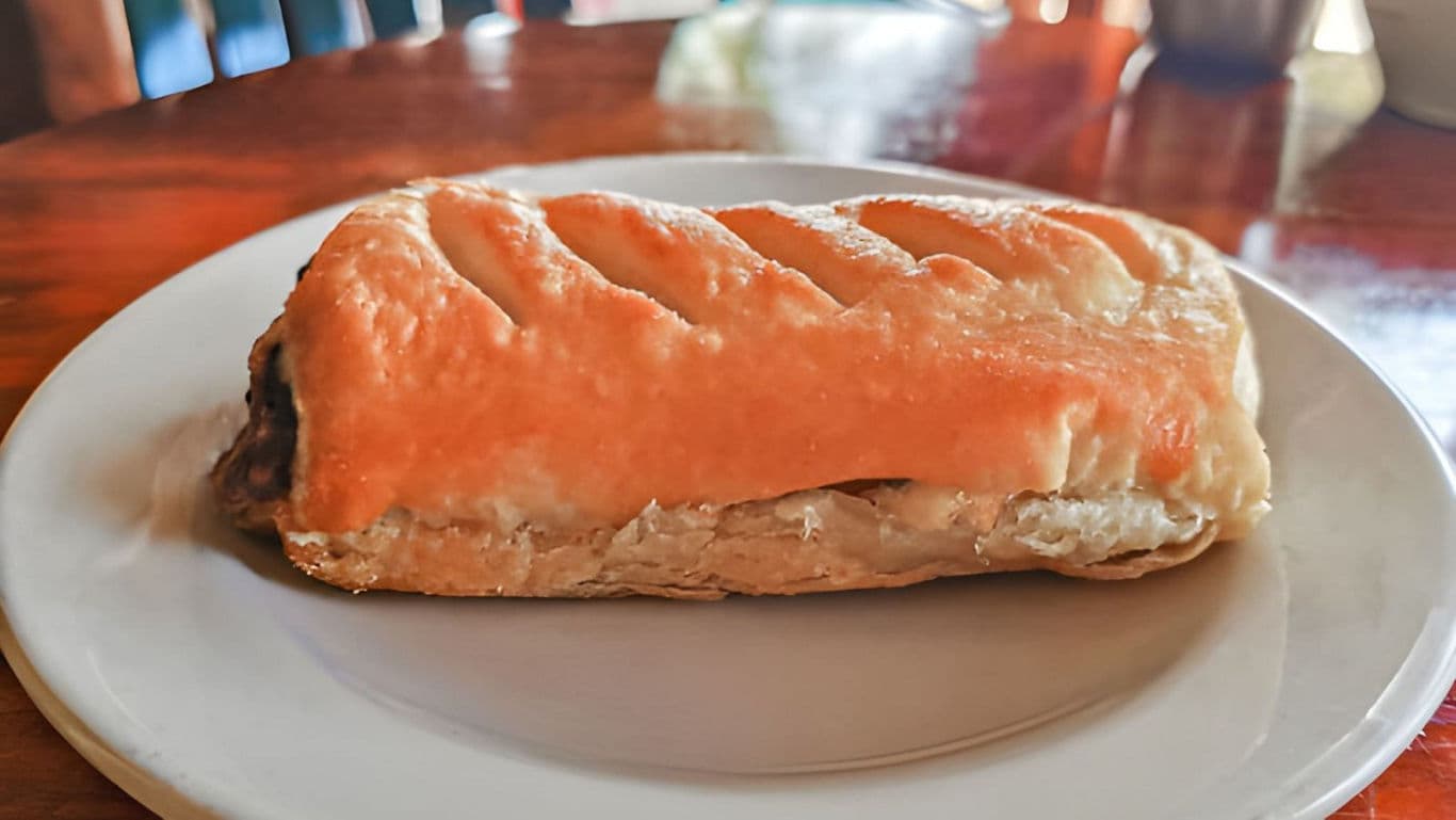 Golden pastry on white ceramic plate